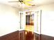 Bedroom with French doors opening to living room at 286 Royal Palm Way, Spring Hill, FL 34608