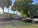 The Palms at Seven Hills community entrance sign amidst lush landscaping at 286 Royal Palm Way, Spring Hill, FL 34608