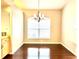 Dining room with hardwood floors and a chandelier at 286 Royal Palm Way, Spring Hill, FL 34608