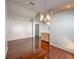 Dining area with hardwood floors, chandelier and convenient door to other areas at 286 Royal Palm Way, Spring Hill, FL 34608