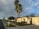 Single-story home with two palm trees in front at 286 Royal Palm Way, Spring Hill, FL 34608