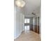 Inviting foyer leading into an open-concept living area with hardwood floors and a ceiling fan at 286 Royal Palm Way, Spring Hill, FL 34608