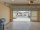 Spacious garage with an open door, providing ample parking and storage space at 286 Royal Palm Way, Spring Hill, FL 34608