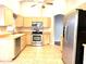 Bright kitchen with stainless steel appliances and light wood cabinets at 286 Royal Palm Way, Spring Hill, FL 34608