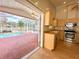 Kitchen opening to a screened lanai and pool, featuring stainless appliances at 286 Royal Palm Way, Spring Hill, FL 34608