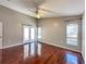 Large main bedroom with vaulted ceiling, hardwood floors, French doors and windows at 286 Royal Palm Way, Spring Hill, FL 34608