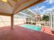 Inviting screened-in pool area with clear blue water and ample deck space for relaxation at 286 Royal Palm Way, Spring Hill, FL 34608