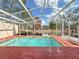 Inviting screened-in pool area with clear blue water and ample deck space for relaxation at 286 Royal Palm Way, Spring Hill, FL 34608