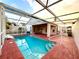 Screened-in pool with a large patio area at 286 Royal Palm Way, Spring Hill, FL 34608