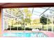 Relaxing pool view from under the screened enclosure at 286 Royal Palm Way, Spring Hill, FL 34608