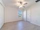 Spacious bedroom featuring light walls, ceiling fan, and wood-look floors at 30822 Veridian Way, Wesley Chapel, FL 33543