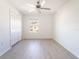 Bedroom with wood-look floors and ceiling fan at 30822 Veridian Way, Wesley Chapel, FL 33543