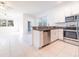 Modern kitchen with stainless steel appliances and white cabinets at 30822 Veridian Way, Wesley Chapel, FL 33543