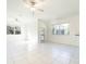 Spacious living area with tile floors and ceiling fans at 30822 Veridian Way, Wesley Chapel, FL 33543