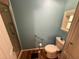 Bathroom featuring a toilet, window, and accessible walk in shower at 3301 Alt 19 # 126, Palm Harbor, FL 34683