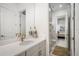 Modern bathroom with a quartz countertop, gold fixtures, and a view of a bedroom at 33843 Galley Way, Wesley Chapel, FL 33543