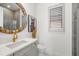 Elegant bathroom featuring a large mirror and stylish vanity at 33843 Galley Way, Wesley Chapel, FL 33543