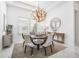 Formal dining room with a large chandelier and seating for six at 33843 Galley Way, Wesley Chapel, FL 33543