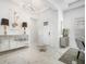 Elegant foyer featuring marble floors, designer lighting, and modern decor at 33843 Galley Way, Wesley Chapel, FL 33543