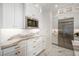 Modern kitchen with stainless steel appliances and white cabinets at 33843 Galley Way, Wesley Chapel, FL 33543