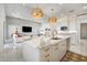 Modern kitchen island with white cabinets and marble countertop at 33843 Galley Way, Wesley Chapel, FL 33543