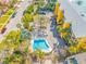 Aerial view of building, pool, and parking at 370 8Th N Ave # 7, Tierra Verde, FL 33715