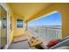 Spacious balcony with lounge chairs, overlooking the water at 370 8Th N Ave # 7, Tierra Verde, FL 33715