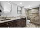 Modern bathroom with double vanity, granite countertops, and a walk-in shower at 370 8Th N Ave # 7, Tierra Verde, FL 33715