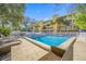 Relaxing community pool area with lounge chairs at 370 8Th N Ave # 7, Tierra Verde, FL 33715