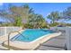 Inviting community pool with a surrounding fence at 370 8Th N Ave # 7, Tierra Verde, FL 33715