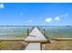 Long dock extending into the water, offering scenic views at 370 8Th N Ave # 7, Tierra Verde, FL 33715