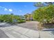 Exterior of Blue Water Bay, a yellow building with parking lot and landscaping at 370 8Th N Ave # 7, Tierra Verde, FL 33715