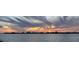 Scenic sunset panorama over the water with colorful clouds reflecting on the horizon at 370 8Th N Ave # 7, Tierra Verde, FL 33715