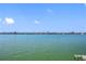 Stunning waterfront view overlooking the calm water and distant shoreline at 370 8Th N Ave # 7, Tierra Verde, FL 33715