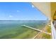 Stunning view of the water, private dock, and distant cityscape at 370 8Th N Ave # 7, Tierra Verde, FL 33715