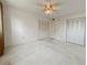 Large bedroom with ample closet space and ceiling fan at 4210 Ironwood Cir # 403J, Bradenton, FL 34209