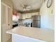 Small kitchen with white cabinets and appliances at 4210 Ironwood Cir # 403J, Bradenton, FL 34209