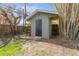 Storage shed in backyard with gray siding at 4724 W Lawn Ave, Tampa, FL 33611