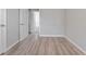 Bedroom with wood-look floors and access to bathroom at 4724 W Lawn Ave, Tampa, FL 33611