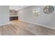 Dining area with wood-look floors and built-in shelving at 4724 W Lawn Ave, Tampa, FL 33611