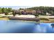 Aerial view of the community clubhouse and lake at 4761 San Martino Dr, Wesley Chapel, FL 33543