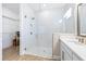 Bathroom featuring a walk-in shower and a vanity with a quartz countertop at 4761 San Martino Dr, Wesley Chapel, FL 33543