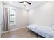 Simple bedroom with twin bed and ceiling fan at 4761 San Martino Dr, Wesley Chapel, FL 33543