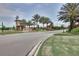 Entrance to the Estancia community, featuring a brick archway and lush landscaping at 4761 San Martino Dr, Wesley Chapel, FL 33543