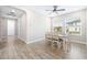 Bright dining room with wood flooring and a table for six at 4761 San Martino Dr, Wesley Chapel, FL 33543