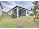 Single-Gathering home with screened porch and well-manicured lawn at 4761 San Martino Dr, Wesley Chapel, FL 33543