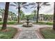 Walkway to the pool with fountain and palm trees at 4761 San Martino Dr, Wesley Chapel, FL 33543