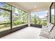 Relaxing screened porch with seating area overlooking backyard at 4761 San Martino Dr, Wesley Chapel, FL 33543