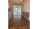 Bright dining area with hardwood floors and sliding glass doors at 4940 Rosedale Ln, Holiday, FL 34690