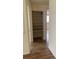 Simple hallway with light walls and wood-look flooring at 4940 Rosedale Ln, Holiday, FL 34690